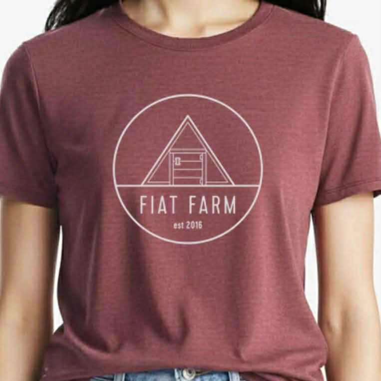 Maroon t-shirt with 'Fiat Farm' logo worn by a person